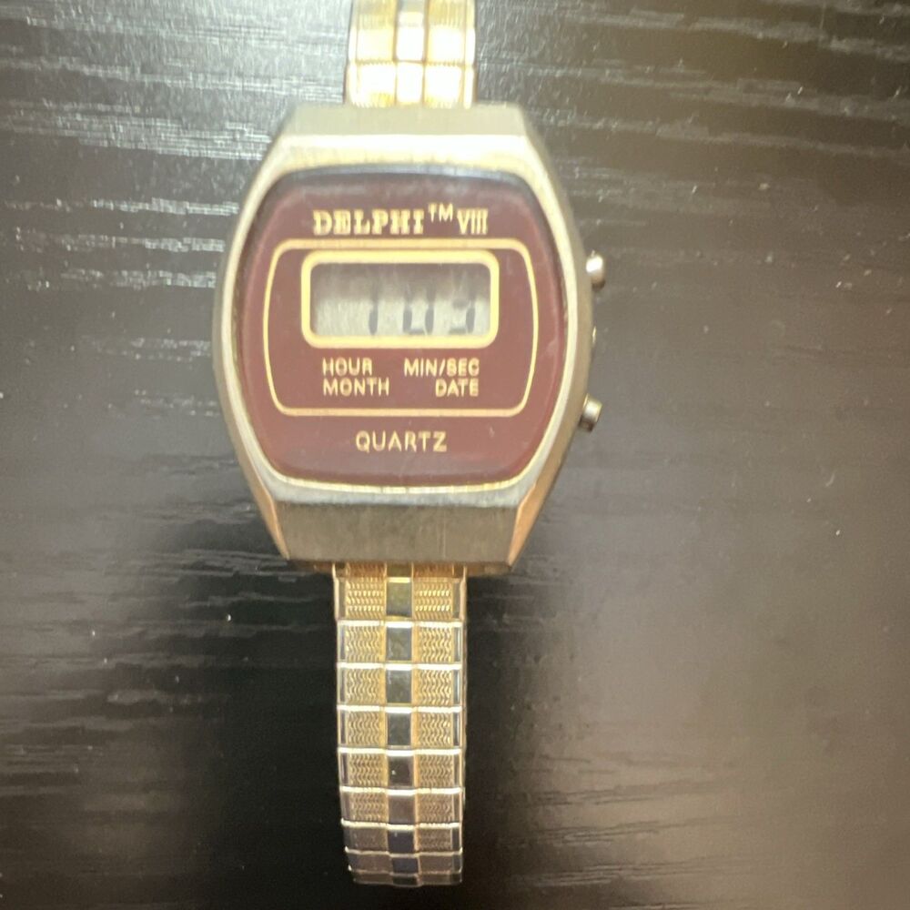 Delphi TM VIII Digital LCD Wristwatch Women Silver Tone with Brown Face
